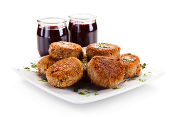 Meatballs with beet soup on white background