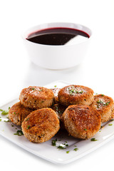 Meatballs with beet soup on white background