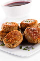 Meatballs with beet soup on white background