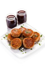 Meatballs with beet soup on white background