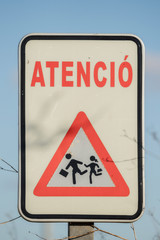 Traffic sign in Spain, Warning children run across the street
