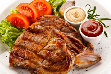 Grilled steaks and vegetables