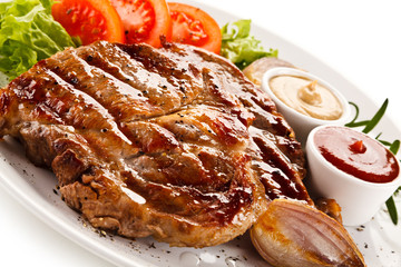 Grilled steaks and vegetables