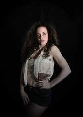 Fototapeta premium Beautiful teenage girl portrait on black background