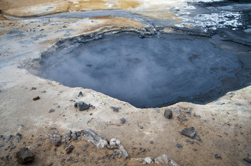 Hverarönd, Iceland. Hot vapors in a typical Icelandic landscape, a wild nature of rocks and shrubs, rivers and lakes.