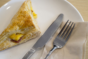 Fresh baked ham cheese pies in a plate.