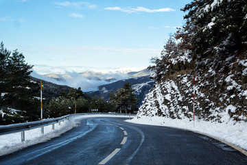 Vivid landscape with road, winter mountain and blue sky.