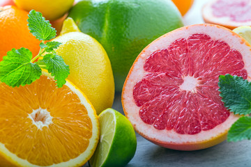 Citrus fresh fruit. Orange grapefruit lemon lime with mint leaves