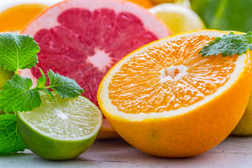 Citrus fresh fruit. Orange grapefruit lemon lime with mint leaves