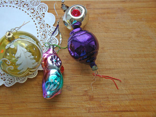 New Year's toys and white napkin on a wooden background