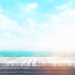 Wood table top on blur sea background. Summer, nature concepts. For montage product display or...