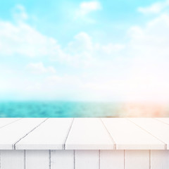 Wood table top on blur sea background. Summer, nature concepts. For montage product display or design key visual layout.