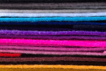 a stack of colorful acrylic felt. Multicolored macrophoto tissueю Background of different colors...
