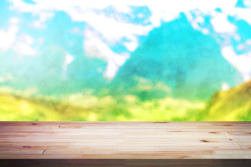 Wood table top on blur mountains background. Nature concepts. For montage product display or design key visual layout.