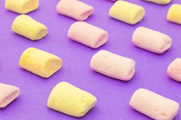 Pattern with marshmallows on violet background