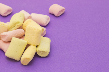 Pattern with marshmallows on violet background