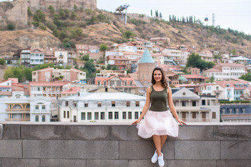 Young  woman travels and walks around the city of Tbilisi in Georgia