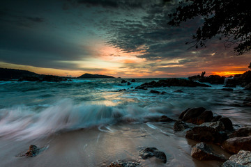 Seascape landscape nature in twilight and rock with colorful of sunset over the sun, Beach Sea, Sunset Sunlight or Sunrise, Twilight Sky Scenic with Sun Silhouette.