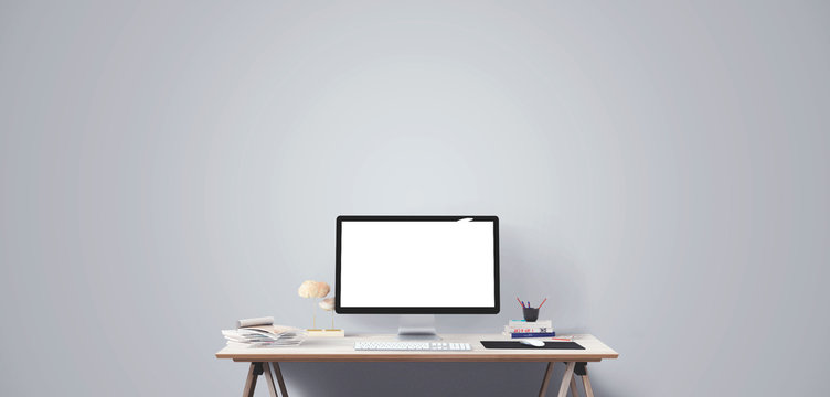 Computer display and office tools on desk. Desktop computer screen isolated. Modern creative workspace. Front view.