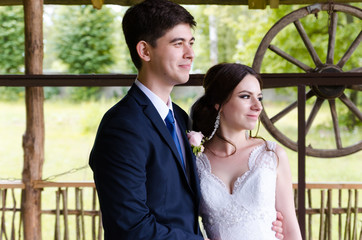 A beautiful married couple in wedding dresses, posing for a photo shooting in an belarusian...