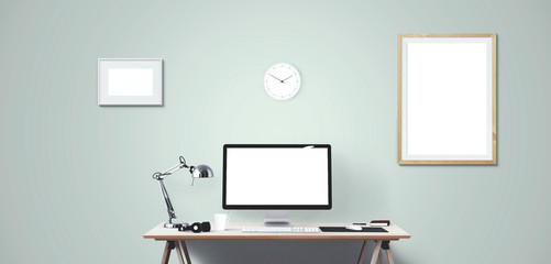 Computer display and office tools on desk. Desktop computer screen isolated. Modern creative workspace background. Front view.