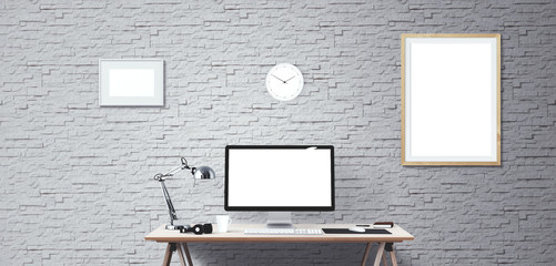 Computer display and office tools on desk. Desktop computer screen isolated. Modern creative workspace background. Front view.