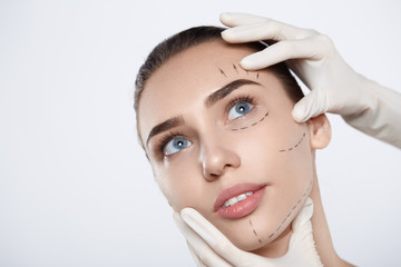 Portrait of attractive woman with plastic surgery at studio