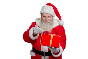 Santa Claus with gift, white background. Portrait of happy Santa Claus pointing on red gift box...