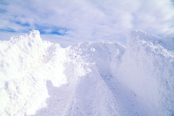 Fototapeta na wymiar Greater heap of a snow on a background of the sky