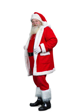 Senior Santa Claus standing on white background. Old authentic Santa Claus in eyeglasses isolated on white background, studio shot.