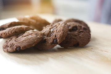 Chocolate cookies on wooden table. Chocolate chip cookies.