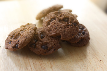 Chocolate cookies on wooden table. Chocolate chip cookies.