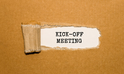 The text KICK-OFF MEETING appearing behind torn brown paper - obrazy, fototapety, plakaty