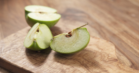 green apple on wood board