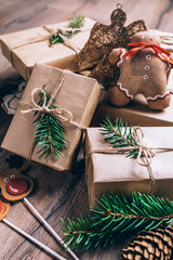 Christmas Gifts with Boxes on Wooden Background. Vintage Style. Closeup, selective focus.