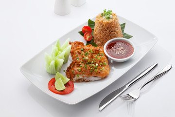 close  up view of nice yummy fried fish fillet  on white back