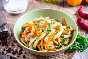Stewed vegetables in a bowl on a wooden table