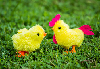 Chicken  toy in the grass