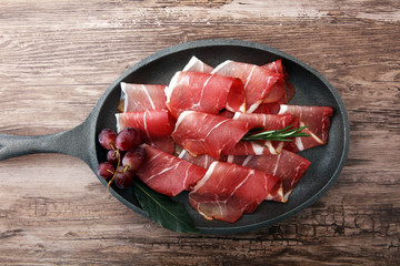 prosciutto with rosemary  or ham of black forest or serrano.