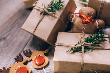 Christmas Gifts with Boxes on Wooden Background. Vintage Style. Closeup, selective focus.
