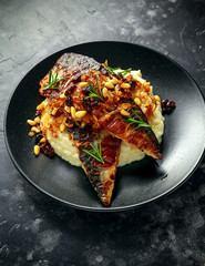 Sicilian style mackerel on cauliflower puree with caramelized onions, pine nuts served with rustic...