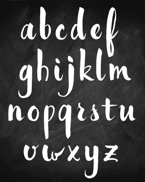 Vector hand drawn alphabet on chalkboard. Brush painted letters.