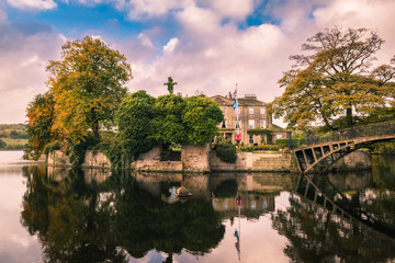 Fototapeta premium Walton Hall in a scenic setting of rolling parkland with its own lake.