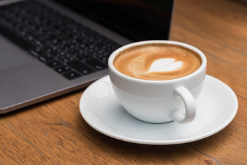 late art hot coffee on wooden floor