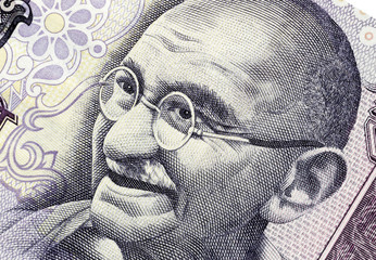 Biella, Italy - October 29, 2017. Banknote with Mahatma Gandhi portrait. Reserve Bank of India - obrazy, fototapety, plakaty