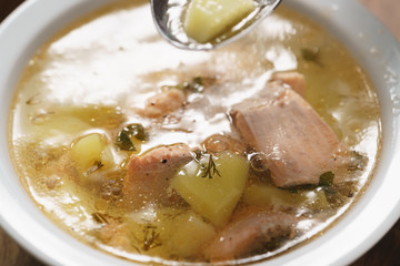 closeup fish soup with trout in bowl