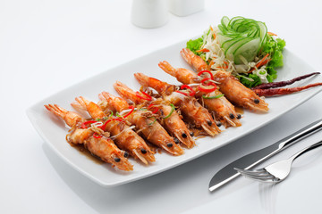 close  up view of nice yummy fried shrimps  on white back