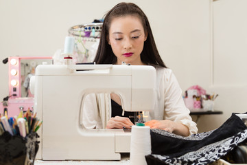 Fashion designer at sewing machine