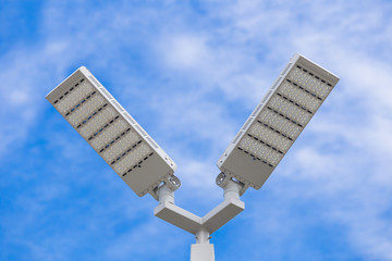 LED street light pole on blue sky with cloud