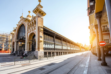 Street view with central food market building in Zaragoza city in Spain